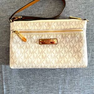 Michael Kors vanilla wristlet with front zip pocket used once no marks